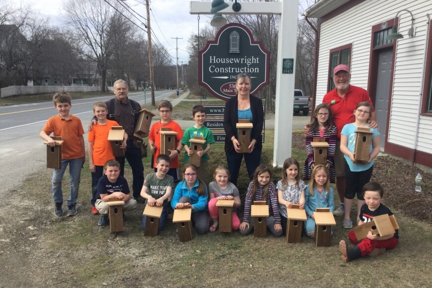 school photo of kids with bird houses