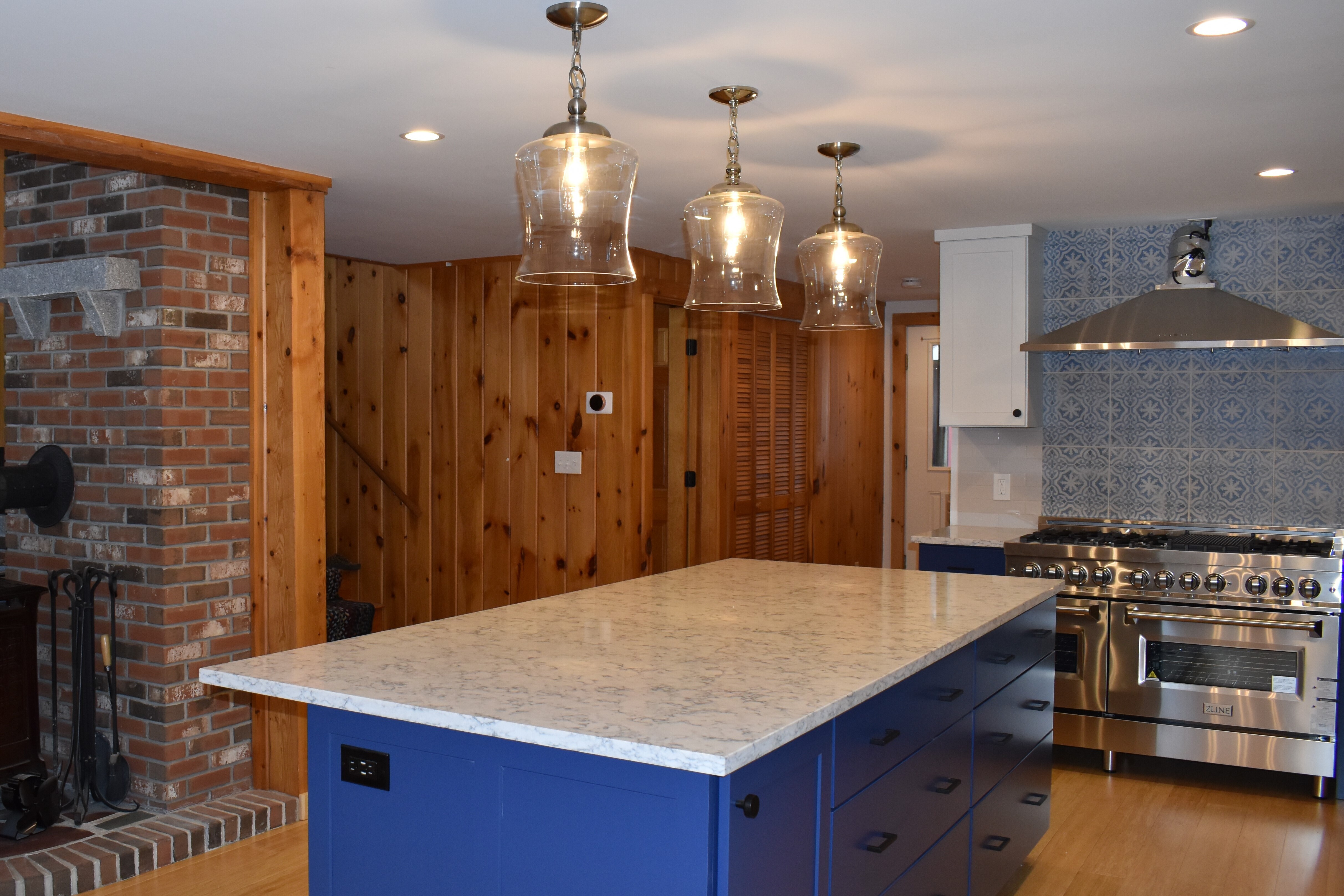 blue kitchen island with marble top