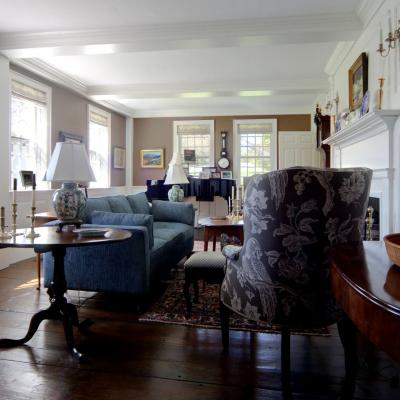 Bright and cozy living room with blue furniture and elegant decor.