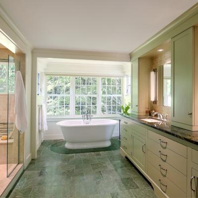 Modern bathroom featuring a freestanding tub, double sinks, and a spacious shower.