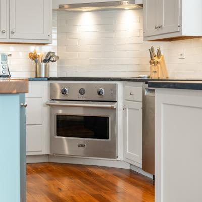 Modern kitchen featuring a stainless steel Viking oven and light-colored cabinetry.