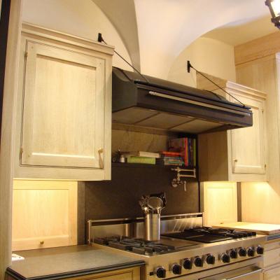 Modern kitchen featuring stainless steel appliances and wooden cabinetry.