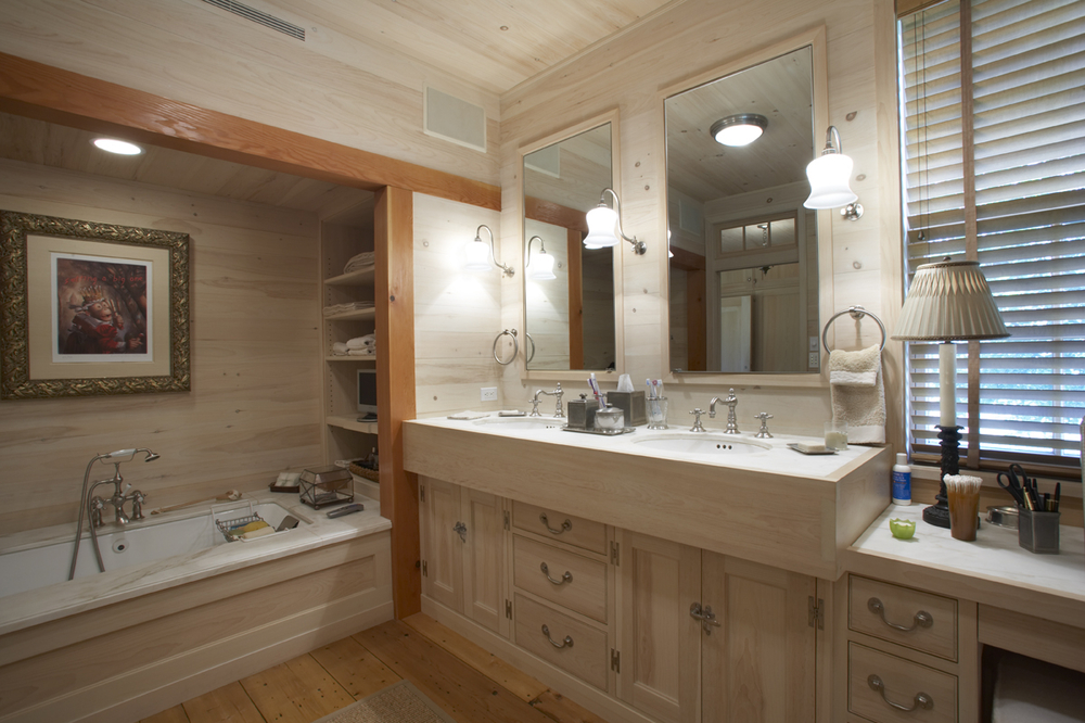 bathroom with double sink and mirrors
