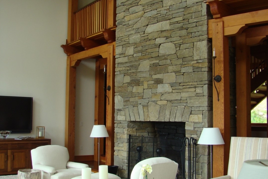 living area with stone fireplace
