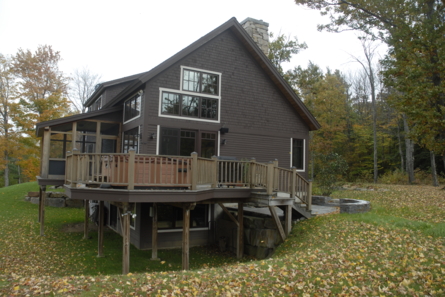 dark colored home with deck