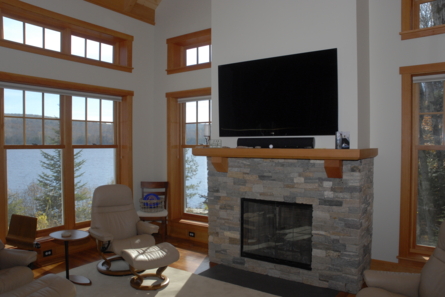 fireplace and tv and lake outside